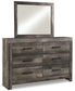 Wynnlow King Crossbuck Panel Bed with Mirrored Dresser